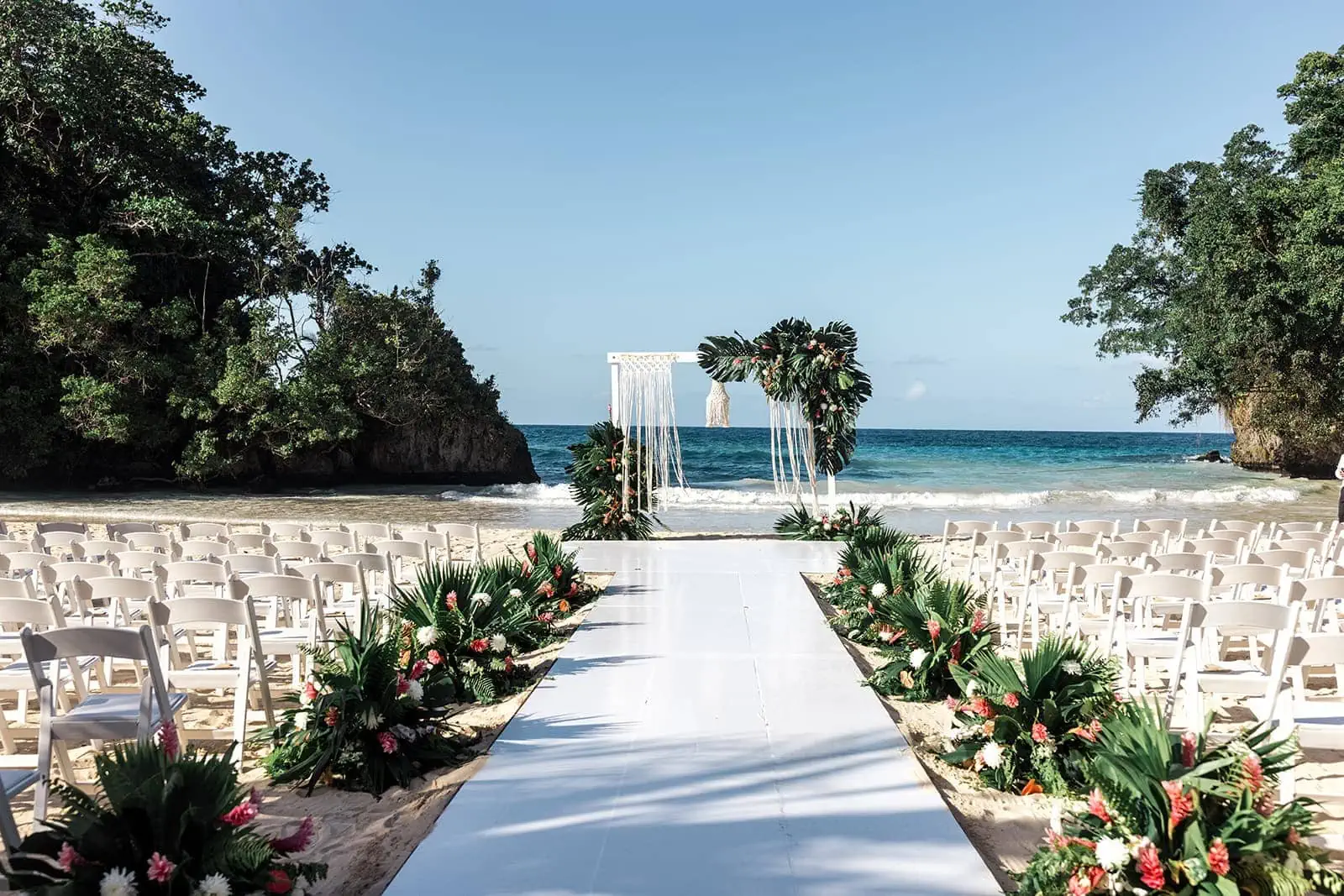 Wedding ceremony set on the beach at Frenchman’s Cove