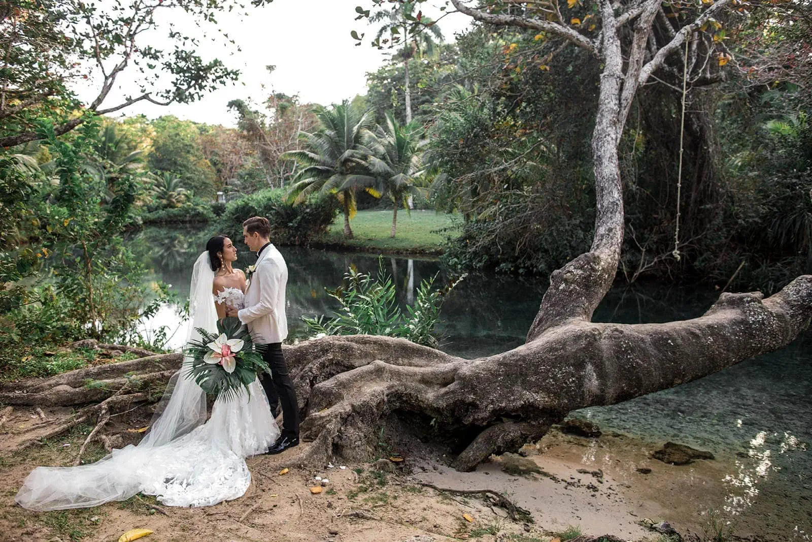 Bride and groom beside the river at Frenchman’s Cove
