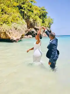 Couple celebrating together in the water at Frenchman’s Cove